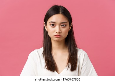 Beauty, People Emotions And Summer Leisure Concept. Close-up Of Gloomy And Sad, Tired Young Asian Female Employee Looking At Camera Reluctant, Standing Distressed Over Pink Background