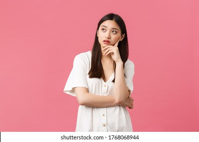 Beauty, People Emotions And Summer Leisure Concept. Annoyed And Exhausted Asian Girl Eye Roll, Looking Away And Exhale Irritated, Feeling Bothered By Someone, Pink Background