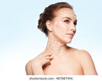 Beauty, People, Plastic Surgery, Anti-age And Health Concept - Beautiful Young Woman Touching Her Neck Over Blue Background