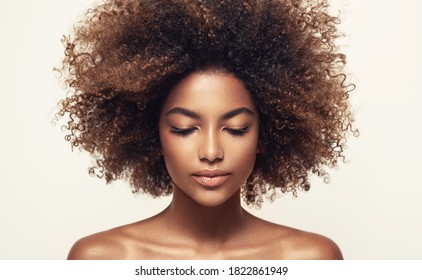 Beauty portrait of african american black  woman with clean healthy skin .Life style and cosmetic. Beautiful afro girl.Curly  hair - Shutterstock ID 1822861949