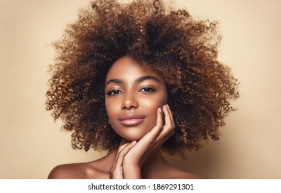 Beauty portrait of african american girl with clean healthy skin on beige background. Smiling dreamy beautiful black woman.Curly hair in afro style