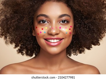 Beauty Portrait Of African American Girl With Afro Hair. Beautiful Black Woman. A Womans Face Decorated With Decorative Hearts. Valentines Day Photo