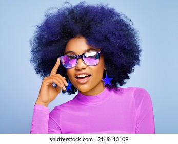 Beauty portrait of African American girl in colored holographic sunglasses. Beautiful black woman on blue background. Cosmetics, makeup and fashion - Powered by Shutterstock