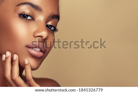 Beauty portrait of African American girl . Beautiful black woman touch her face . Facial  treatment . Cosmetology , skin care  and spa .  Сток-фото © 
