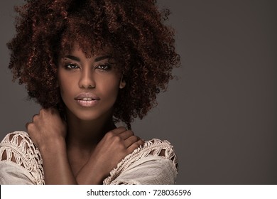 Beauty portrait of african american woman with afro hairstyle and glamour makeup.