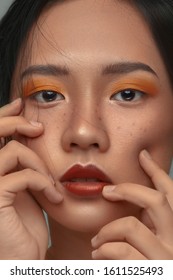 Beauty Portrait Of Asian Female Face With Natural Skin, Tan Skin Tone, Beautìul Makeup.