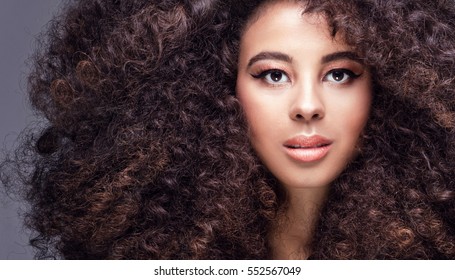 Beauty portrait of attractive african american woman with big afro and glamour makeup.