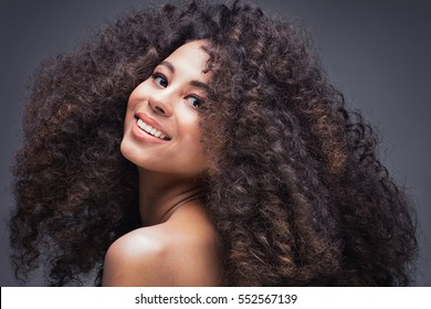 Beauty Portrait Of Attractive African American Woman With Big Afro And Glamour Makeup.