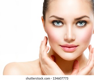 Beauty Portrait. Beautiful Spa Woman Touching Her Face. Perfect Fresh Skin. Isolated On White Background. Pure Beauty Model. Youth And Skin Care Concept