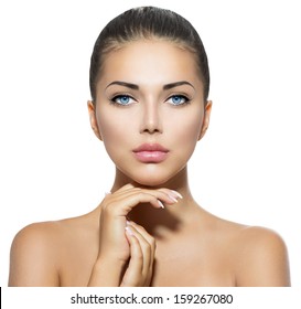 Beauty Portrait. Beautiful Spa Woman Touching her Face. Perfect Fresh Skin. Pure Beauty Model Girl. Youth and Skin Care Concept 