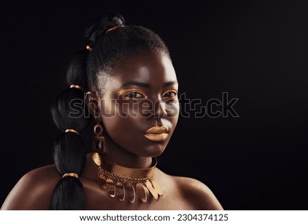 Beauty, portrait and black woman in studio with glitter, luxury and art makeup on dark background. Face, gold and African lady model with rich, glow and jewelry, elegance and cosmetic royal aesthetic
