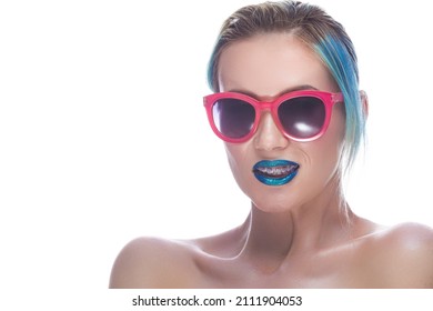 Beauty Portrait Of Fancy Caucasian Female With Silky Skin And Teeth Brackets Wearing Red Sunglasses As Dental Healthcare Ideas.Horizontal Image