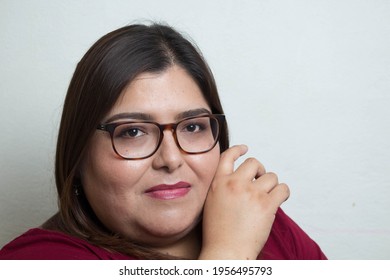 beauty portrait of fat hispanic woman smiling wearing glasses