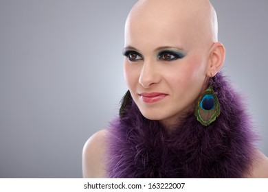 Beauty Portrait Of Hairless Woman In Purple Boa.