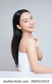 Beauty portrait of happy Asian female face with natural skin on white background - Shutterstock ID 2069112413
