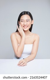 Beauty portrait of happy Asian female face with natural skin on white background - Shutterstock ID 2163524407