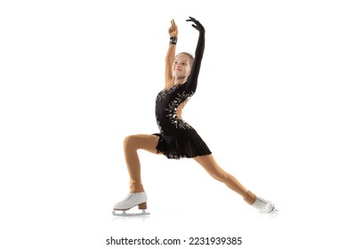 Beauty. Portrait of little flexible girl, figure skater wearing stage attire posing isolated on white studio background. Graceful and weightless. Concept of movement, sport, beauty. Copy space for ad