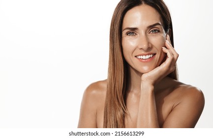 Beauty Portrait Of Mature Woman Smiling With Hand On Face. Closeup Face Of Happy Adult, 40s Years, Woman Feeling Fresh After Anti-aging Treatment. Smiling Beauty Looking At Camera With Perfect Skin