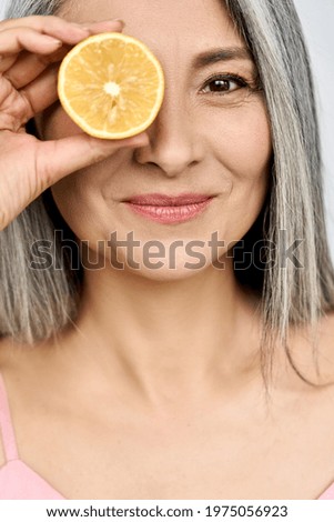 Similar – Image, Stock Photo orange in hand on orange wall