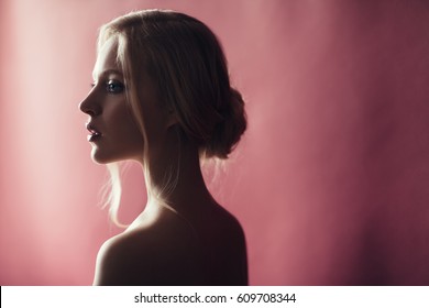 Beauty Portrait Of Nordic Natural Blonde Woman On Pink Background With Copy Space. Side View