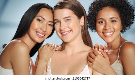 Beauty Portrait Of Three Diverse Multiethnic Models On Isolated Background. Sensual Happy Asian, Black And Caucasian Women With Natural, Healthy Skin. Wellness, Spa, Cosmetology, Skincare Concept.