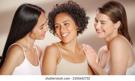 Beauty Portrait Of Three Diverse Multiethnic Models On Isolated Background. Fun Joyful Asian, Black And Caucasian Women With Natural, Healthy Skin. Wellness, Spa, Cosmetology, Skincare Concept.