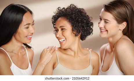 Beauty Portrait Of Three Diverse Multiethnic Models On Isolated Background. Sensual Happy Asian, Black And Caucasian Women With Natural, Healthy Skin. Wellness, Spa, Cosmetology, Skincare Concept.