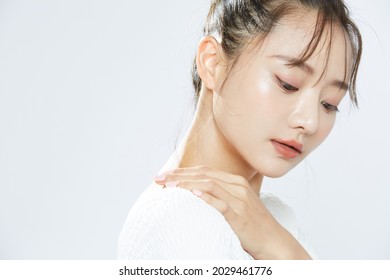 Beauty Portrait Of A Young Asian Woman With Bun Hair