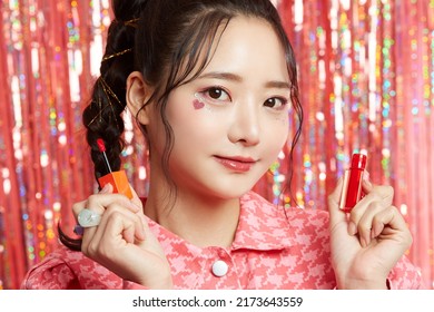 Beauty Portrait Of A Young Asian Woman With Sticker Makeup On Glittery Background