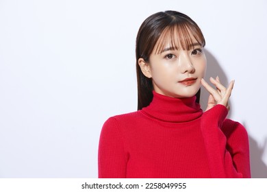 Beauty portrait of young Asian woman in red knit - Powered by Shutterstock