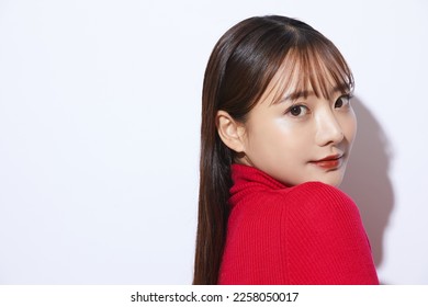 Beauty portrait of young Asian woman in red knit - Powered by Shutterstock