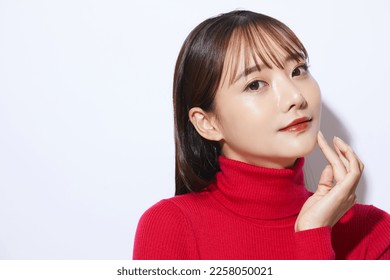 Beauty portrait of young Asian woman in red knit - Powered by Shutterstock