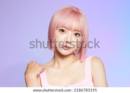 Beauty portrait of a young Asian woman with pink hair