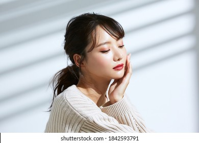 
Beauty Portrait Of Young Asian Women On Light And Shadow Background