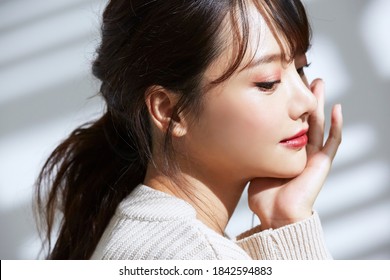 
Beauty Portrait Of Young Asian Women On Light And Shadow Background