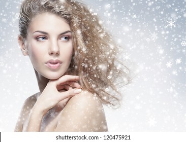 Beauty Portrait Of Young Attractive Woman Over Snowy Christmas Background