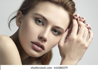 Beauty portrait of young beautiful glamour red-haired model girl with long straight hair. Professional makeup. Vogue style.