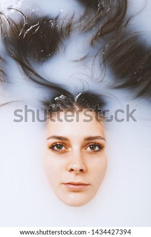 Similar – Teenage woman surrounded by confetti