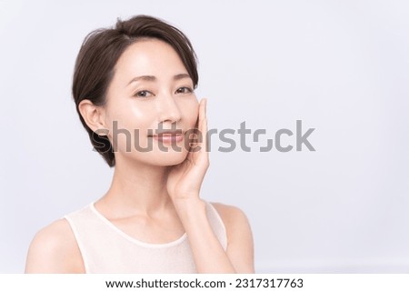 Beauty portrait.Asian woman is touching her cheek. Stockfoto © 