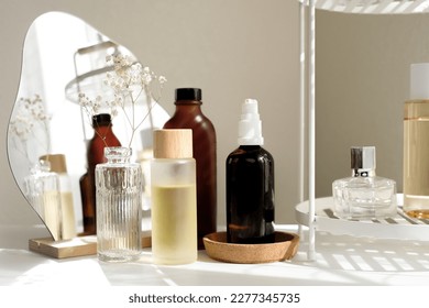 The beauty product and skincare set on the bath shelf with luxury flowers and a mirror for the spa concept.   - Powered by Shutterstock