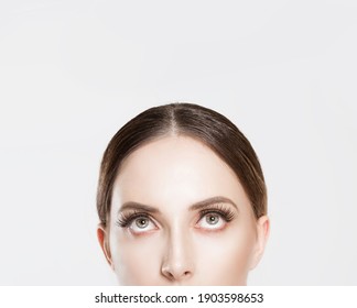 Beauty Puzzled Thinking. Closeup Portrait Woman Girl Natural Nude Makeup False Eyelashes Looking Up Big Eyes Open Skeptical Isolated White Background Wall, Horizontal Image Studio Shot. 