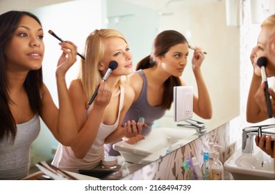 Beauty Queens. Shot of three friends applying makeup in front of the mirror. - Shutterstock ID 2168494739