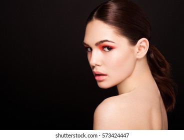 Beauty red eyes and lips makeup fashion model on black background