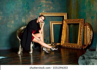 Beauty Rich Brunette Woman In Luxury Interior Near Empty Frames, Wearing Fashion Clothes, Lifestyle Pretty Real People Concept