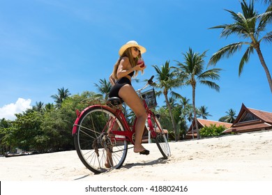 The Beauty Riding A Bicycle On The Beach At Sunset,the Stylish Girl By Her Bicycle, The Beach Cruiser Bicycle, A Road Bicycle Look Of Style,the Kind Stylish Woman In A Hat Sports,Thailand,island Samui