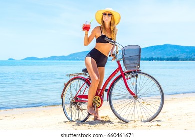 The Beauty Riding A Bicycle On The Beach At Sunset,the Stylish Girl By Her Bicycle, The Beach Cruiser Bicycle, A Road Bicycle Look Of Style,the Kind Stylish Woman In A Hat Sports,Thailand,island Samui