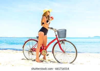 The Beauty Riding A Bicycle On The Beach At Sunset,the Stylish Girl By Her Bicycle, The Beach Cruiser Bicycle, A Road Bicycle Look Of Style,the Kind Stylish Woman In A Hat Sports,Thailand,island Samui