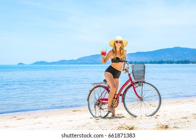 The Beauty Riding A Bicycle On The Beach At Sunset,the Stylish Girl By Her Bicycle, The Beach Cruiser Bicycle, A Road Bicycle Look Of Style,the Kind Stylish Woman In A Hat Sports,Thailand,island Samui