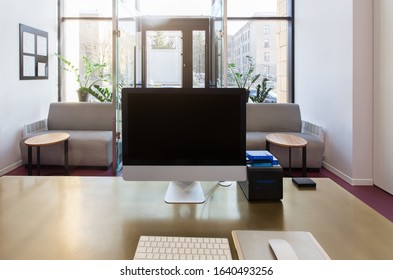 Beauty Salon Interior. Reception Desk With Computer And Black Blank Screen, Copy Space