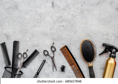 Beauty saloon. Haidressing tools on grey table background top view copyspace